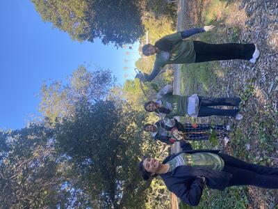Berkeley Project Day volunteers hold ivy they've removed
